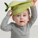 Green striped hat for baby carried by child