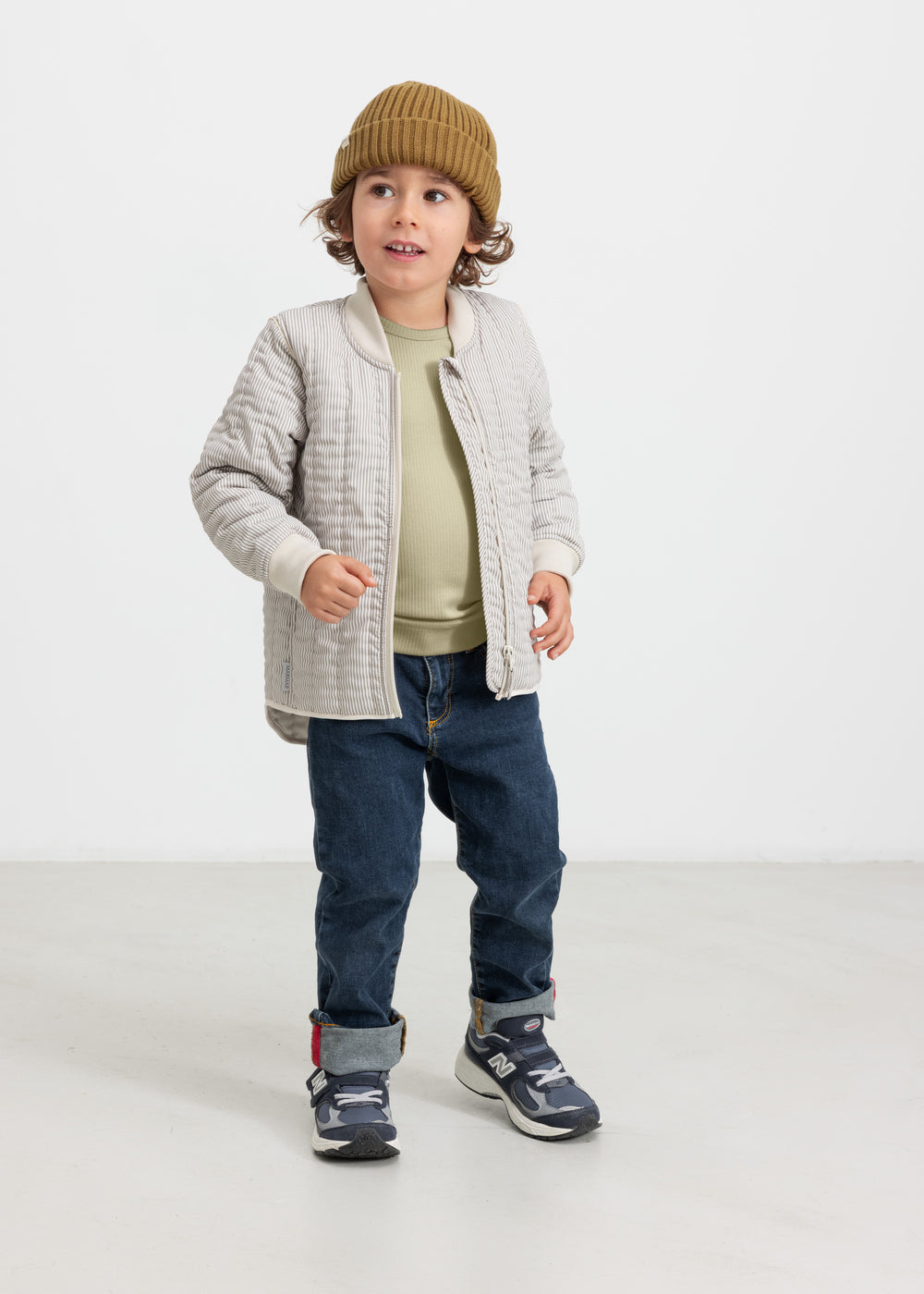 Children wearing dark brown striped thermal jackets.