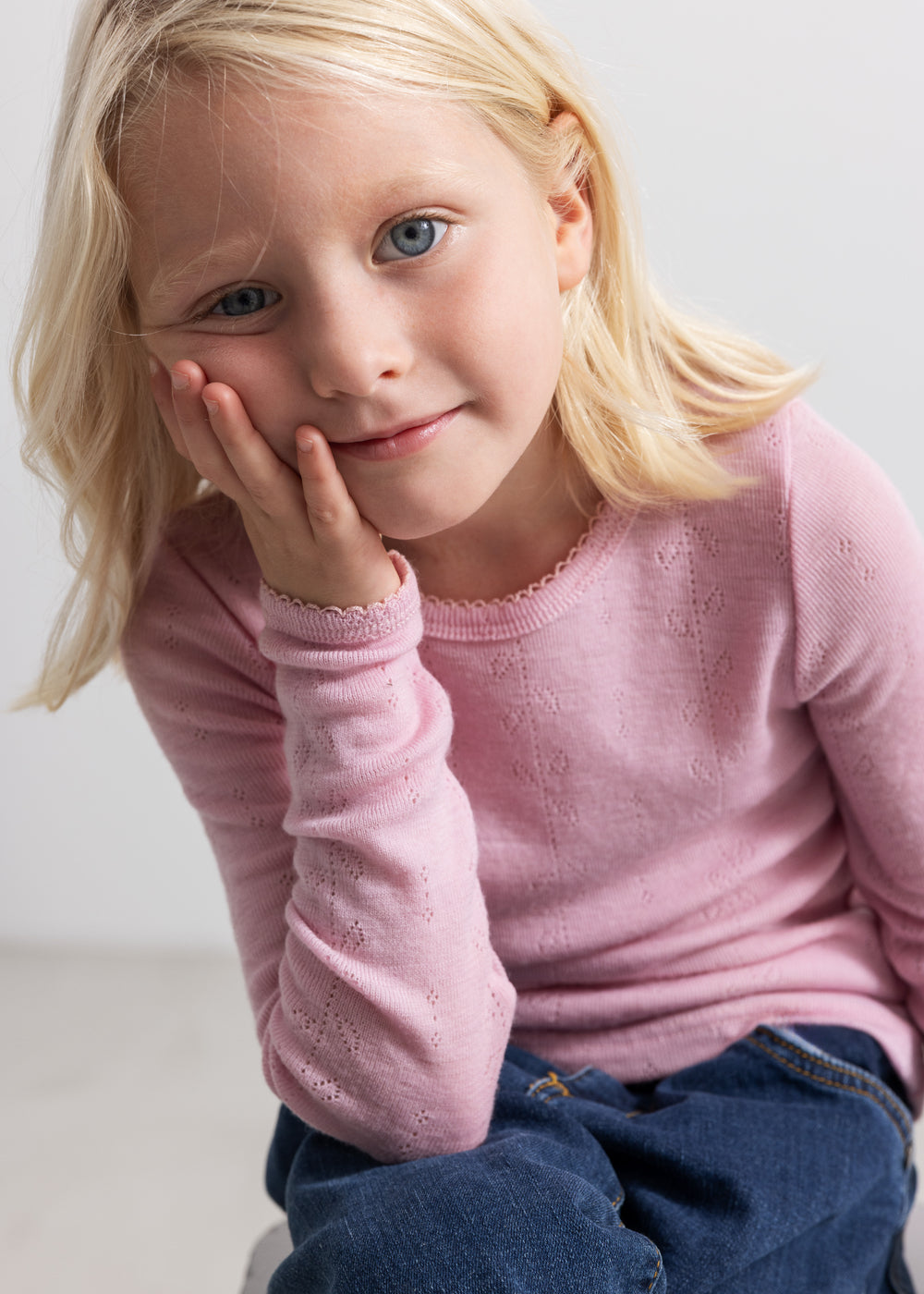 Pink children's T‑shirt with long sleeves and a round neckline