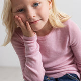 Pink children's T‑shirt with long sleeves and a round neckline