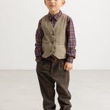 Brown boys' vest with button closure, worn over a checkered shirt.
