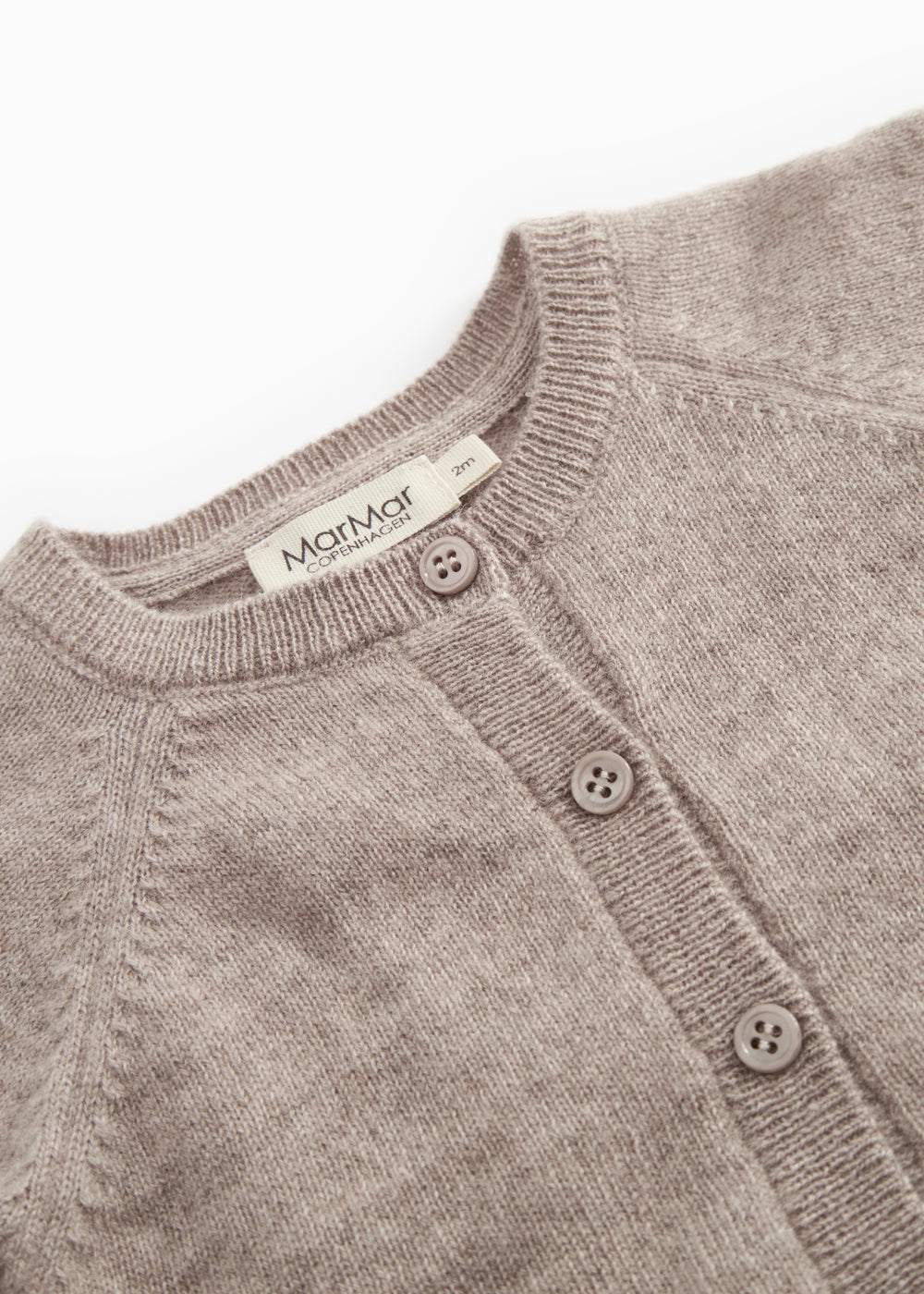 Button front and rib collar on the Tamla cashmere cardigan in alpaca blend.