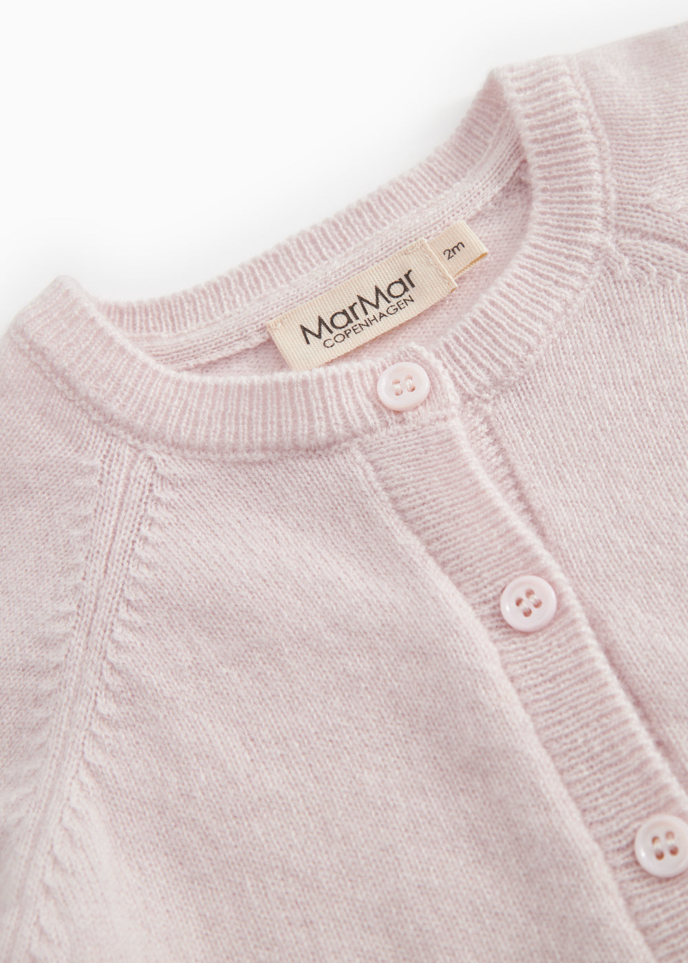 Pink Kashmir cardigan with ribbed edge, button closure, and MarMar Copenhagen label at the collar.