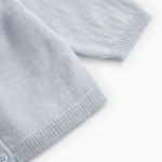 Light blue cardigan with ribbed cuffs and hem.