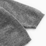 Gray heathered cashmere cardigan with ribbed cuffs and hem.