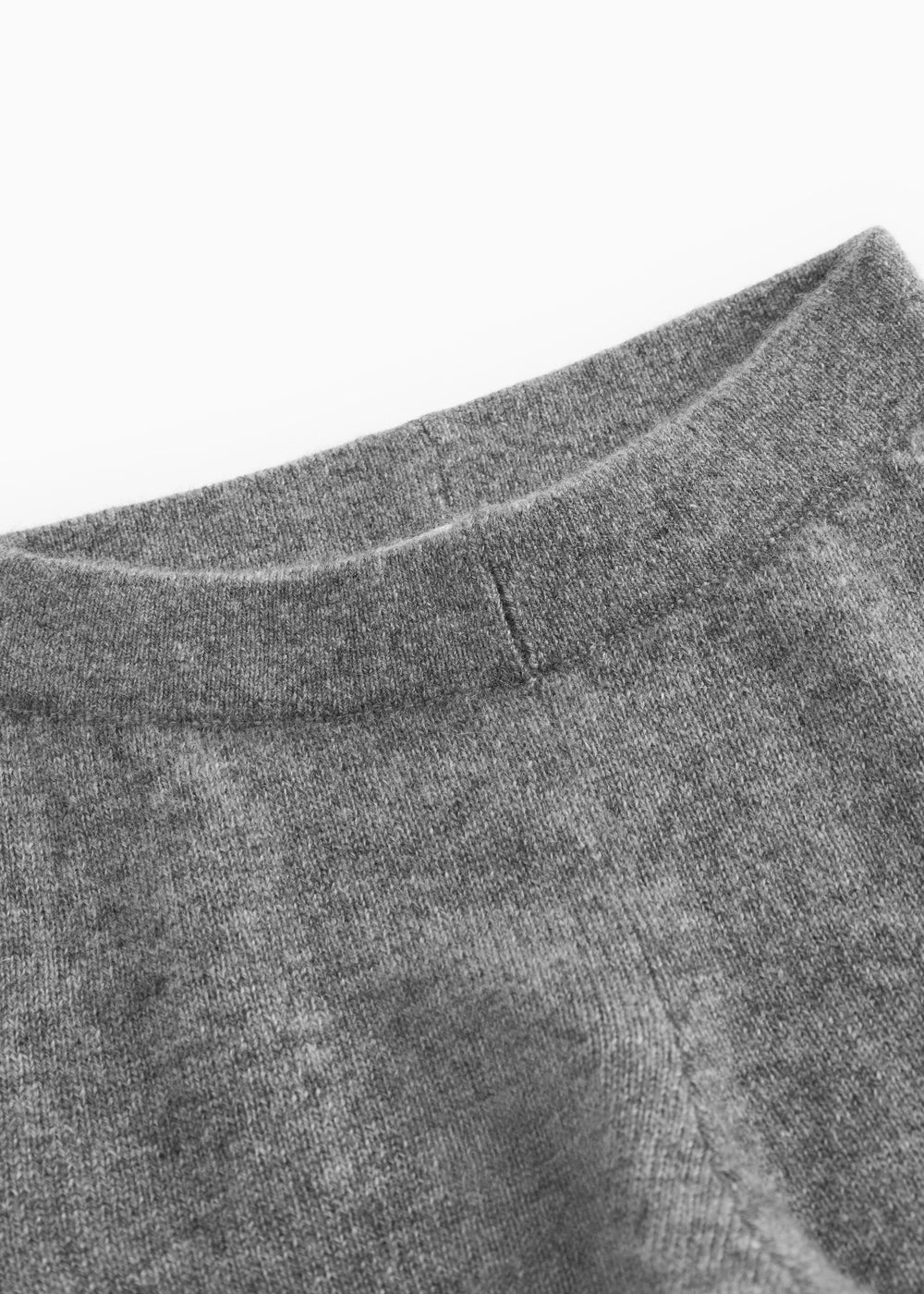 Gray melange Kashmir trousers with smooth lining and side seams.