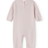 Pink cashmere blend suit with button closure at the neck and long trousers.