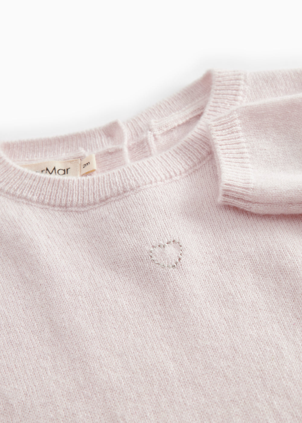 Pink cashmere blend dress with ribbed edge and button closure at the neckline.