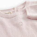 Pink cashmere blend dress with ribbed edge and button closure at the neckline.