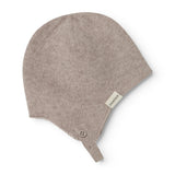 Aly Baby babyhue with a small button on the front and a textile label on the side.