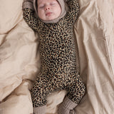 Gray matte fur on baby with opening at the face.