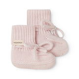 Pink knitted baby shoes with laces and rib pattern.