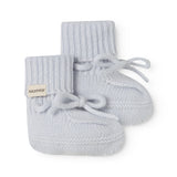 Knitted baby shoe in light blue with laces and ribbed edge