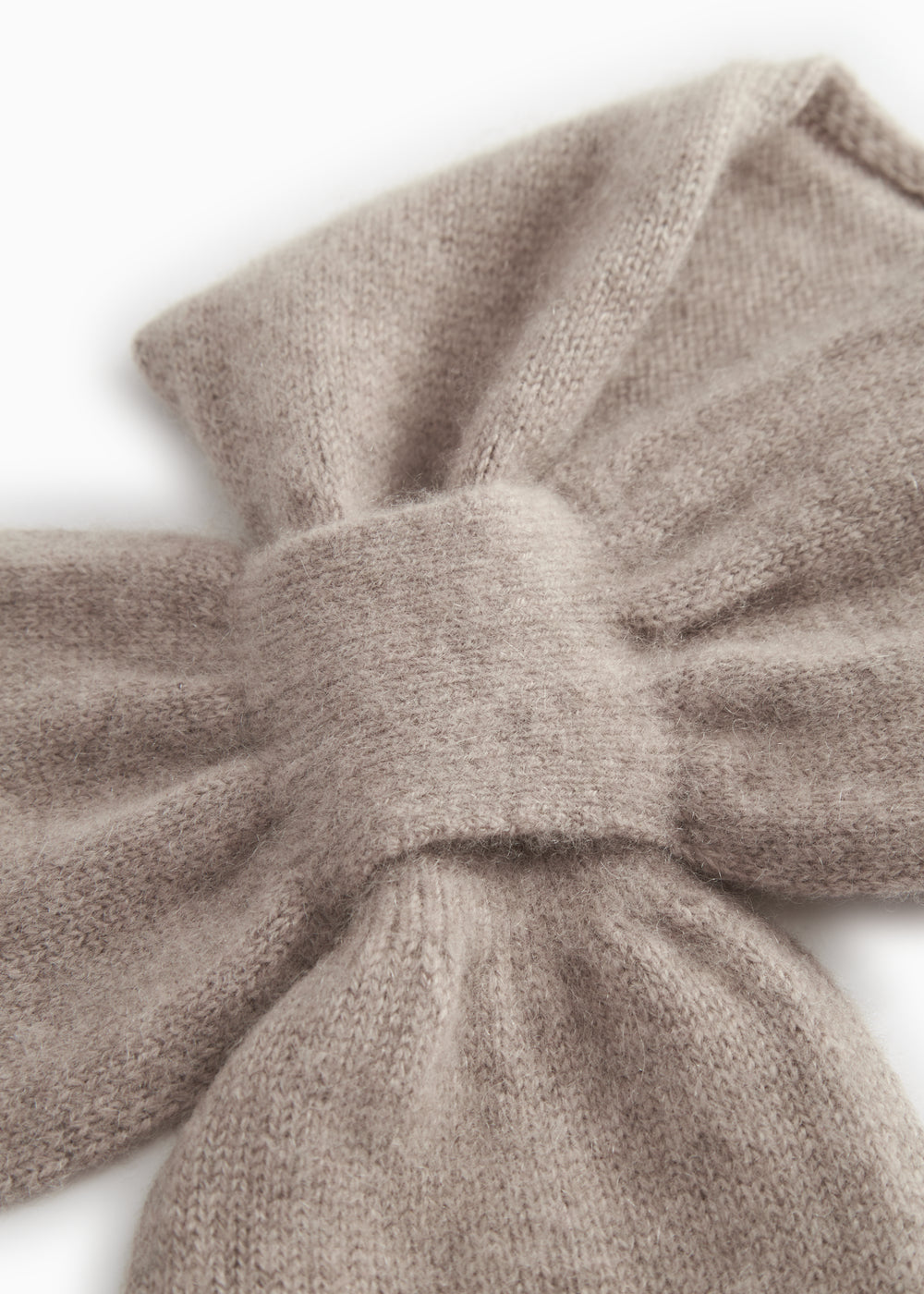Baby scarf in alpaca blend, beige marled, tightly knitted knot and seam.