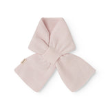 Cashmere baby blanket, pink, folded and tied as a bow.