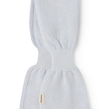 Light blue cashmere scarf for baby with fabric label, knitted and folded.