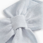 Light blue cashmere scarf with knot and soft knitted texture