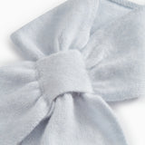 Light blue cashmere scarf with knot and soft knitted texture
