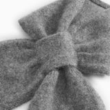 Mixed baby blanket in cashmere with knot/loop-shaped fold.