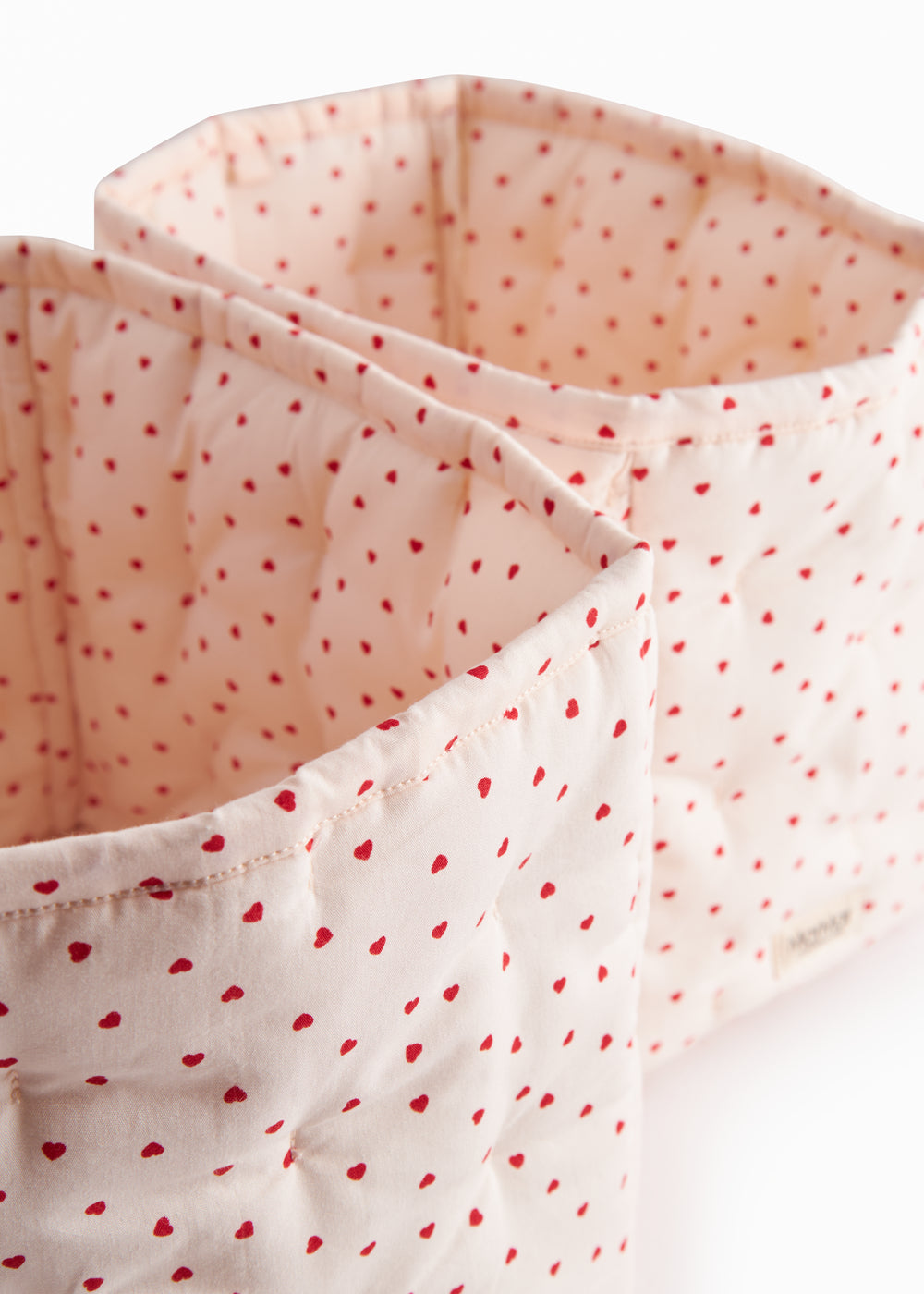 Quilted curve with a sweet heart print, storage for leg warmers.