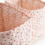 Quilted curve with a sweet heart print, storage for leg warmers.