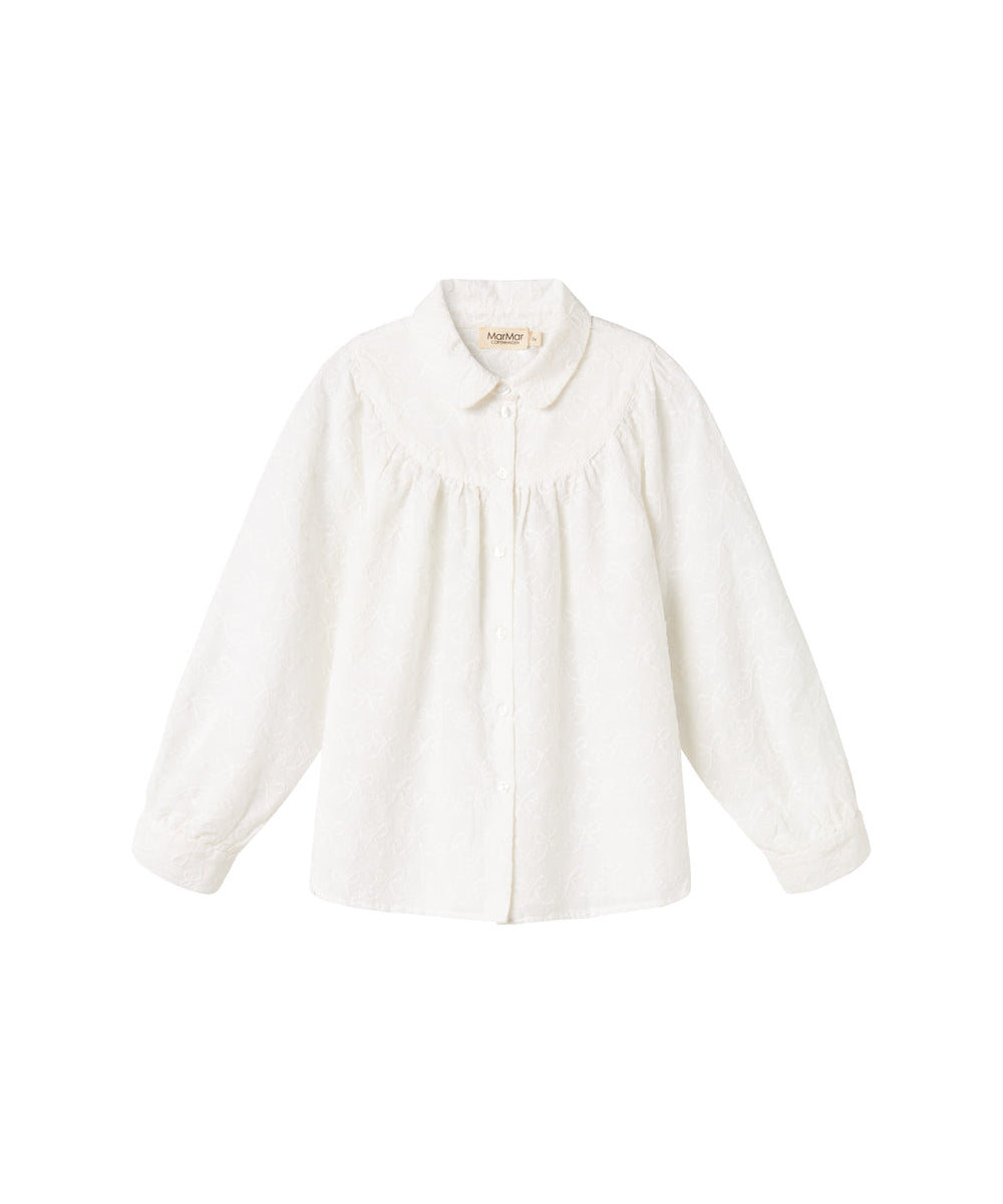 Hvid bluse til børn med broderet mønster og rund krave