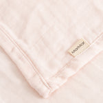 Ada (2-pack) cloth diaper in pink, folded corner with Marble brand.