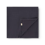 To-pak diapers in dark blue with folded edge and visible label.