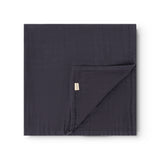 Dark blue wrap with diagonal fold and small label tab.