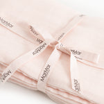 Rose wrap with tie and MamMar labels at the knot.