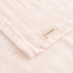 Close-fitting rose bodice, slanted seams and MamMar label at the edge.