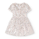 Short-sleeved dress with silver sequins and a light skirt, round neckline.