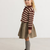 Brown A-line skirt with elastic waistband worn by child