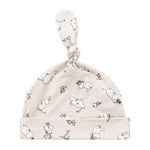 Babyhue med Moomin-print i lyse farver og knude på toppen