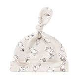 Babyhue med Moomin-print i lyse farver og knude på toppen