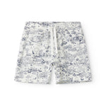 Shorts for children with a fine Moomin print, wide elastic, and ties at the waist.