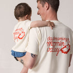 Adult and baby set back-to-back wearing matching T-shirts with Mumin print.