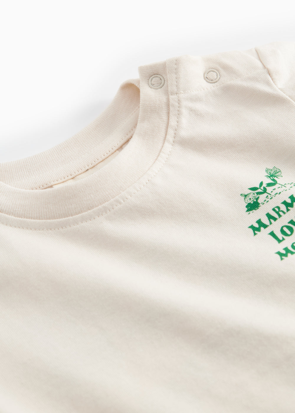 Raw white T-shirt with green Moomin print for baby