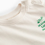 Raw white T-shirt with green Moomin print for baby