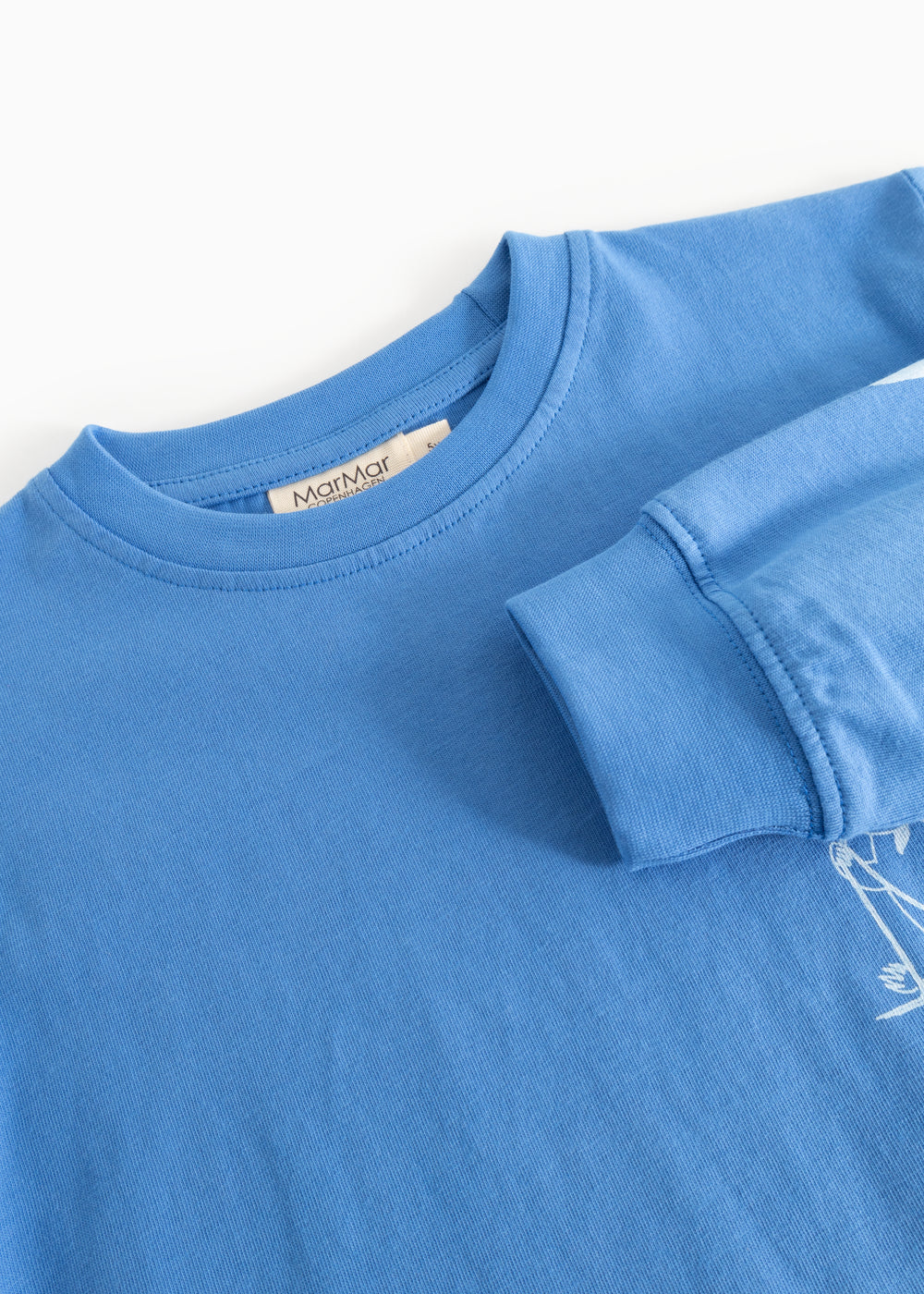 Blue long-sleeve blouse with round neck and seam detail at shoulder/sleeve
