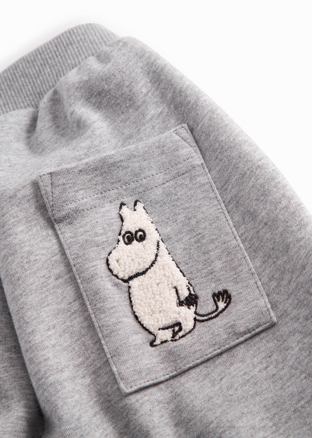 Gray sweatpants for baby with Moomin print, elastic and drawstring.