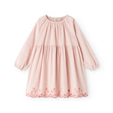 Pink dress with long sleeves, round neckline, and red trim along the hem.
