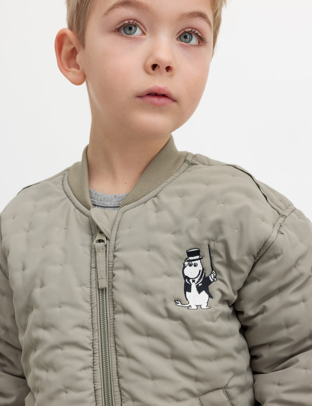Children's green quilted jacket with Moomin print