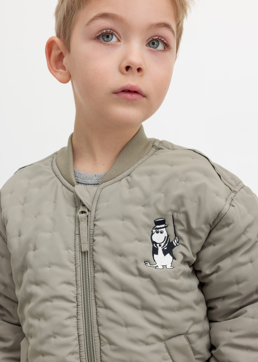 Children's green quilted jacket with Moomin print