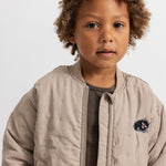 Barely beige stripe with ribbing and reverse side.