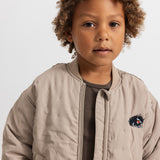 Barely beige stripe with ribbing and reverse side.