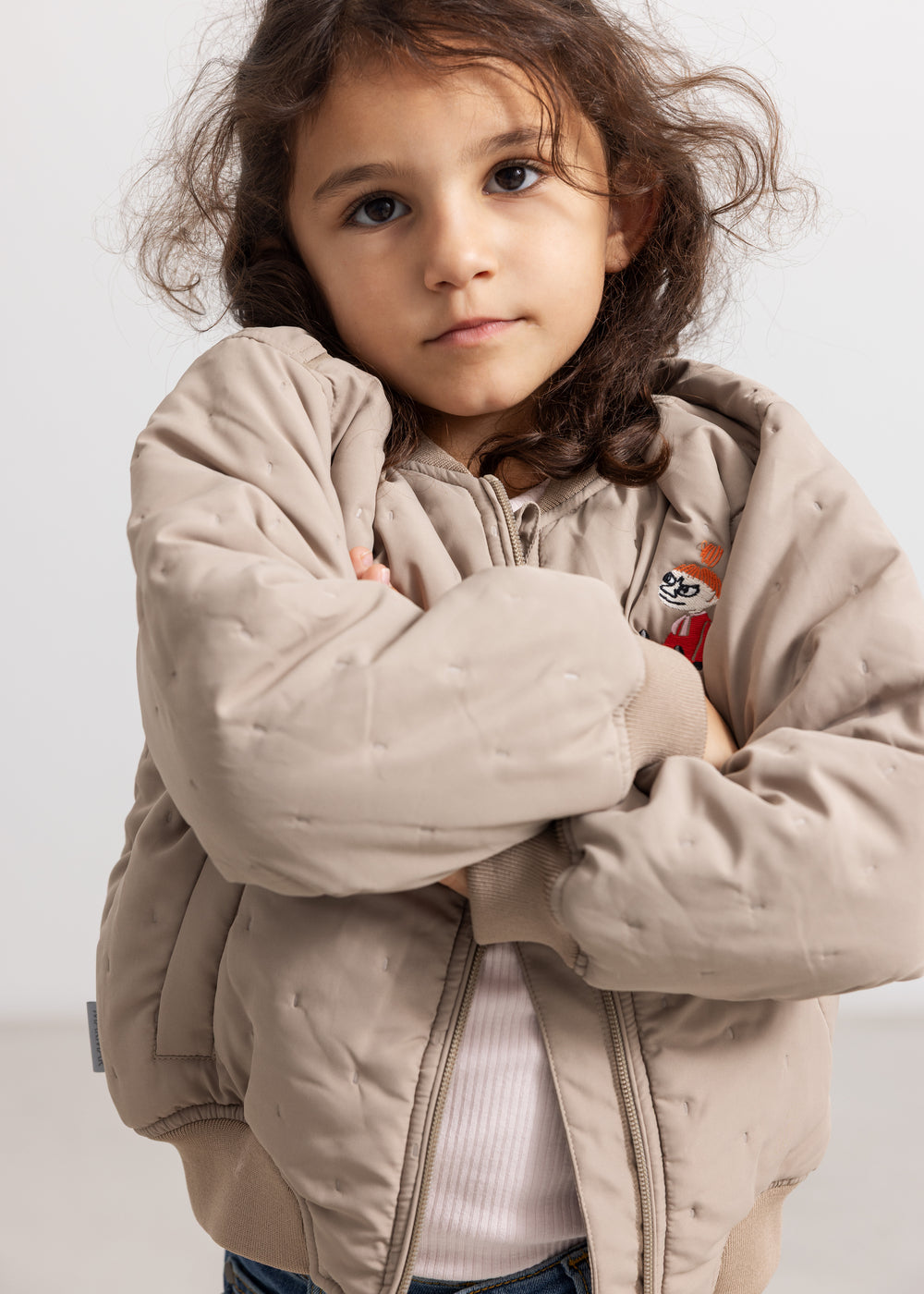 Light gray insulated jacket with zipper, hood, and front press.