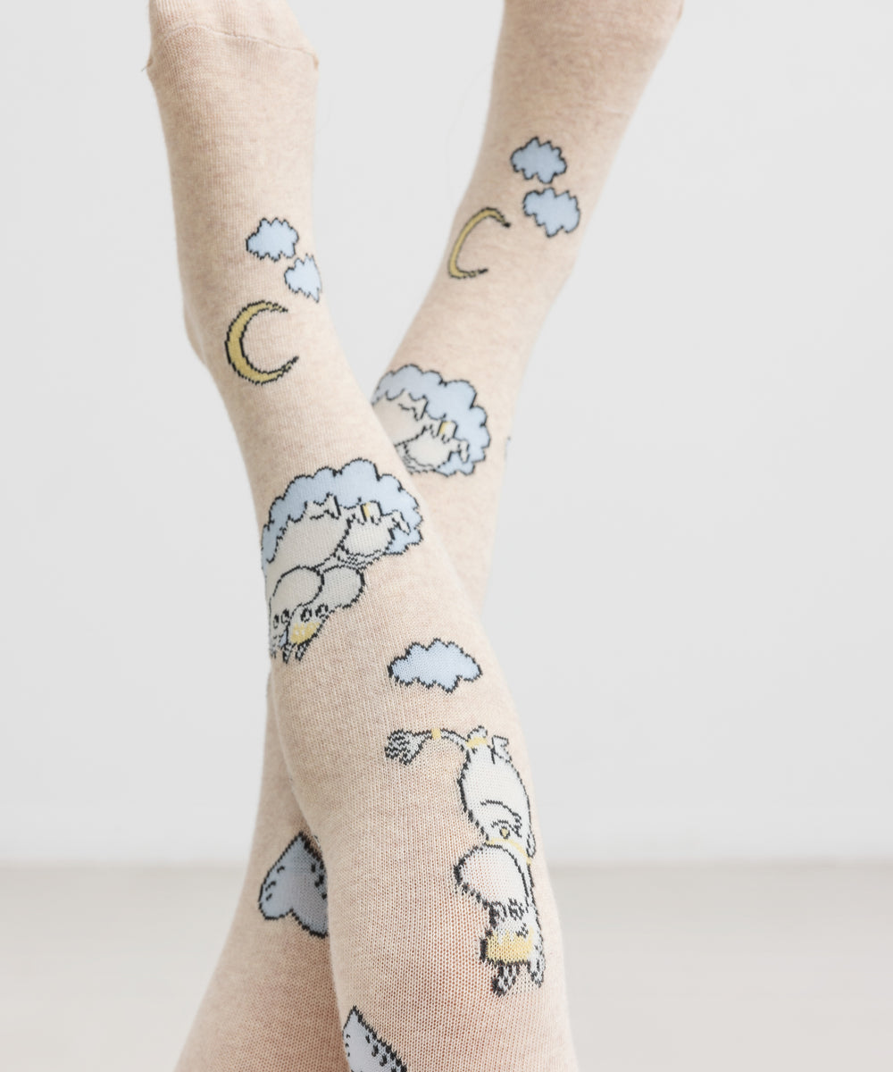 Cremefarvede børnestrømpebukser med Moomin figurer, måne og skyer