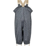 Børne-regnbukser i mørkeblå med små hvide blomster, justerbare seler og fodstropper