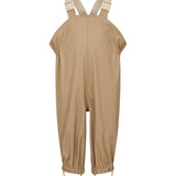 beige regnbukser med seler og fodstropper, set forfra